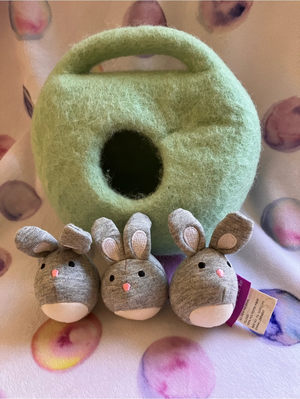 Lovevery Green Felt bunnies in a burrow